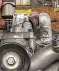 Mechanic using All-In-One Pro Grade 209 Piece SAE And Metric Master Impact Socket Set on engine in workshop.