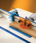 3 Inch Fence Flip-stop With 5 16 Inch T-Bolt Pins Vise Stations positioned on a woodworking table, securing a wooden piece.