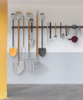 Solid Metal 64 Inch Wall Mount Garden Tool Organizer With 4 Rails And 16 Hooks For Garage hung with assorted tools