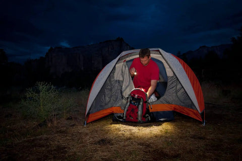 Person using Rugged Aluminum Flashlight With 450 Lumens And Flood To Spot Focus Built For Pocket EDC And Outdoor Adventures Handheld Light For Camping Hiking Emergencies in tent