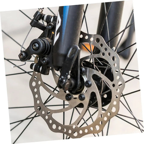 Close-up of Complete Mechanical Disc Brake System For Mountain Bike Front And Rear With Forged Aluminum Calipers and rotor.