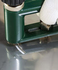Adjustable Circle Hole Cutter for Sheet Metal 2 to 12 Inch cutting through metal with drill, close-up of action with glove