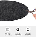 Round 27.5 Inch Recliner Floor Mat Non Slip Felt Pad For Hardwood Floors being cut with scissors, highlighting its tailorable feature.