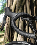 Road Bike Handlebar Tape With Silicone Surface For A Sticky Sweatproof Grippy Feel EVA Comfort Shock Absorbing Non Slip Tape Stain Resistant Finish Includes Aluminum Bar Plugs Set Of 2 In Black on bike outdoors