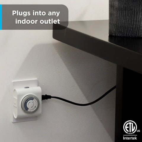 24 Hour Mechanical Outlet Timer Switch with dual grounded plug in control, plugged into indoor wall outlet next to furniture, no WiFi needed.