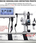 High Speed Online Industrial Inkjet Batch Coder Machine For Printing Date Barcode Logo And Graphic On Production Line. Display with nozzle and printed labels.
