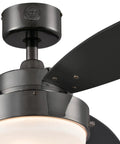Close-up of Indoor 42 Inch Ceiling Fan With Light In Gun Metal Finish, showing reversible black blade and opal frosted glass light kit.