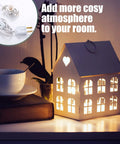 Lit 24 Pack LED Light Bulb Cords Kit with Switch 6 Ft Warm White Wire used in decorative house lamp display in cozy room.
