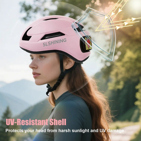 Women's LED Bike Helmet Go-To With Turn Signals And Brake Light, UV-resistant shell, pink, worn by woman outdoors, side view