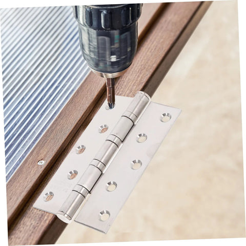 Stainless steel door hinge, two-piece design, being drilled into wood during installation