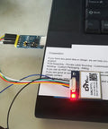 GPS Receiver Module 3.3V-5V with Flash Ceramic Antenna 9600bps NMEA-0183 attached to cables on desk for Arduino use