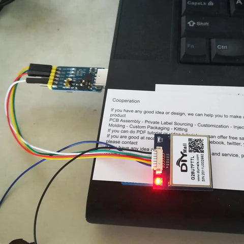 GPS Receiver Module 3.3V-5V with Flash Ceramic Antenna 9600bps NMEA-0183 attached to cables on desk for Arduino use