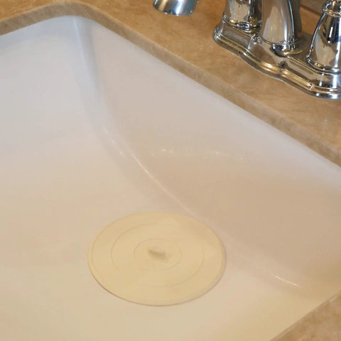 5 Inch Flat Suction Rubber Sink Stopper Fits Most Kitchen And Bathroom Sinks And Tub Drains White Durable Rubber Corrosion Resistant Easy To Use No Fuss Quick Seal For Stopping Water placed in a sink