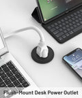 2 Inch Flush Mount Desk Power Grommet With Built In US Outlet And 3.28 Ft Heavy Duty Cord, positioned next to laptop and phone.