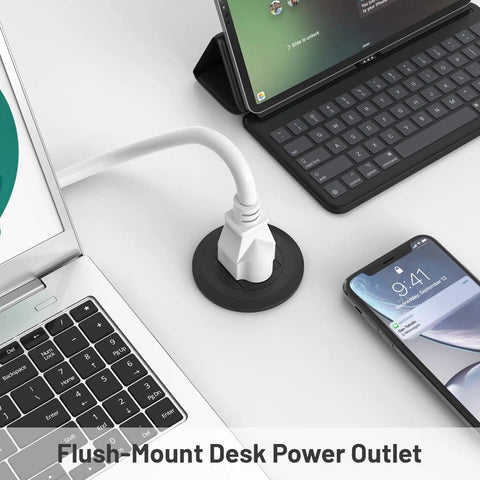 2 Inch Flush Mount Desk Power Grommet With Built In US Outlet And 3.28 Ft Heavy Duty Cord, positioned next to laptop and phone.