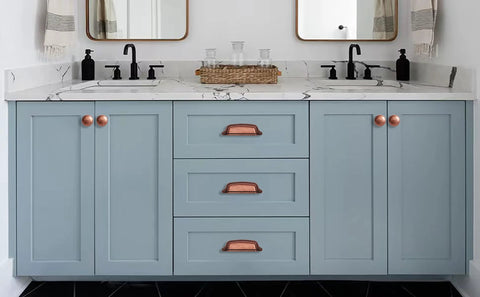 Antique Copper Cabinet Knobs 10 Pack Center Mount 1-1/4 Inch Zinc Vintage Retro Drawer and Kitchen Cabinet Pull Hardware installed on blue vanity