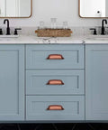 Antique Copper Cabinet Knobs 5 Pack One And A Quarter Inch Zinc Single Hole Center Pulls For Kitchen Cabinets And Drawers Vintage Retro Hardware Classic Rustic Cabinet Knobs For Home Renovation installed on blue cabinets