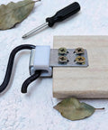 Rock Solid Upholstery Spring Clips Repair Kit For Saggy Couches And Sofas Includes Complete Set Of Carbon Steel Screws With Socket Driver on wood.