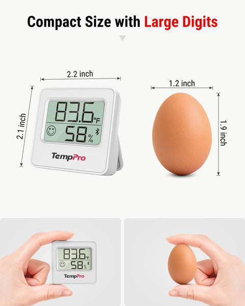 Bluetooth Digital Hygrometer Indoor Thermometer With 260 Ft Range And Comfort Icons No Fuss Dry Comfort Wet For Quick Humidity And Temperature Readouts At Home Or Office. Compact 2.2 inch white digital hygrometer next to egg for size comparison