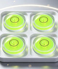 4Pcs Small Circular Bubble Levels, Double Sided Adhesive Bottom Mini in a tray, featuring bright green liquid and clear design.