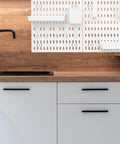 Medium Size Nail Free Wall Pegboard Organizer With Heavy Duty Hooks And Solid Wood Panel above a kitchen sink for efficient storage.
