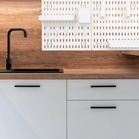 Medium Size Nail Free Wall Pegboard Organizer With Heavy Duty Hooks And Solid Wood Panel above a kitchen sink for efficient storage.