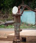Four Piece Pitcher Pump Gasket Set For Hand Water Pumps White PVC Sealing Gaskets installed on an outdoor pump