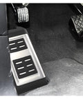 Knockout Clutch Pedal Pads For Vw Touareg 2007 To 2018 showing rubber dead pedal cover with integrated footrest in a car interior.