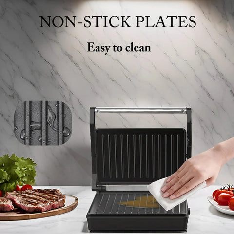 Multi Purpose Compact Contact Grill Sandwich Maker Panini Press With Floating Hinge Non Stick Plates shown being cleaned.