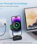 Nifty 5000mAh PD Fast Charging Power Bank For iPhone 14 And 13 Series charging a phone with pass-through technology by a laptop.