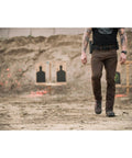 Person wearing Beefy 1.5 Inch Nylon Tactical Belt With Stainless Steel Buckle Converts To Tie Down Or Harness Heavy Duty Everyday Belt For Men And Women Charcoal Large Style 59409 at shooting range