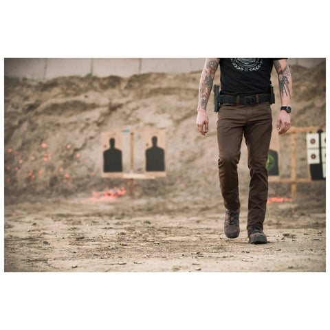 Person wearing Beefy 1.5 Inch Nylon Tactical Belt With Stainless Steel Buckle Converts To Tie Down Or Harness Heavy Duty Everyday Belt For Men And Women Charcoal Large Style 59409 at shooting range