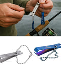 Stainless Steel Fishing Line Nipper Cutter With Keychain For Fly Fishing Dope Compact Tool For Precise Line Cutting And Hook Eye Cleaning And Corrosion Resistant Clip held next to fishing rod.