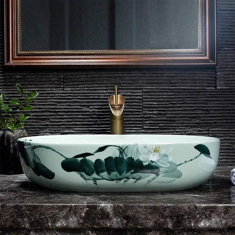 Super Chic Oval Above Counter Bathroom Vanity Vessel Sink Premium Porcelain Ceramic Washbasin with floral design on a countertop.