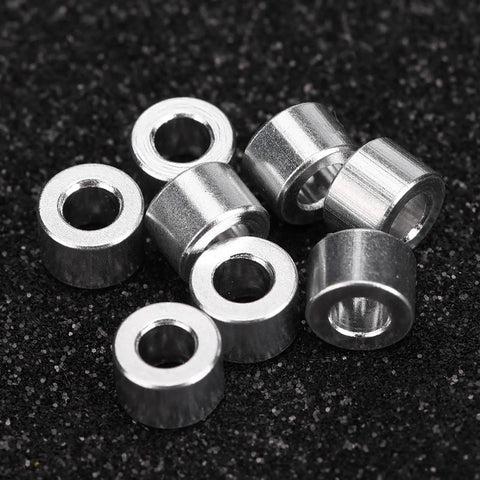 RC Car Shock Spacers Set With Eight Aluminum 6mm Upper Mount Spacers for Axial SCX10 on black surface