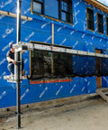 Metaltech Aluminum Pump Jack 2000 installed on a blue-wrap construction site