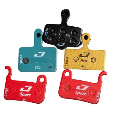 Heavy Duty Disc Brake Pads Crafted For Badass Stopping Power And Tight Control On Mountain Bikes Featuring Whisper Quiet Operation with various colors.