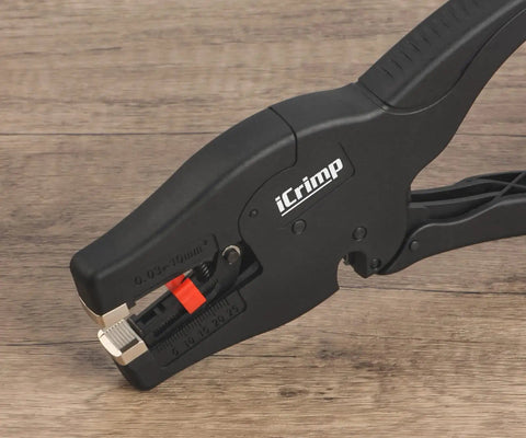 Automatic Wire Stripper With Built In Cutter For AWG 32 To 7 0.03-10 Mm2 shown on wooden surface close-up