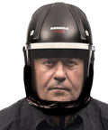 Badass Powered Air Respirator And Hearing Protection Bundle For Woodworking Shops Featuring Full Face Impact Shield Heavy Duty Dust Filters And Integrated Ear Guards Built Tough For Sanding Routing And Turning worn by a man.