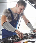 Mechanic wearing Five Pack Cut Resistant Arm Sleeves For Men And Women, Level Five Bite Proof Forearm Guards while working on a car engine