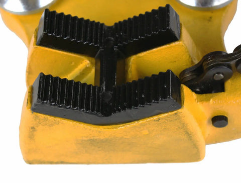 Close-up of BC 510 6 Inch Bench Chain Pipe Vise jaw and chain showing rugged cast-iron grip with yellow finish for mounting versatility.
