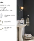 Banbury Pivoting Toilet Paper Holder In Brushed Nickel, shown in a modern bathroom setting with matching accessories.