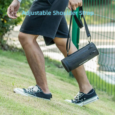 Person carrying Front Frame Bike Handlebar Bag Waterproof Storage Bag With Large Capacity For Road Bike And MTB, showing adjustable strap.