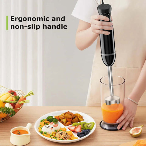 Hella Powerful 300 Watt Immersion Hand Blender Wand with ergonomic handle blending carrot soup in a clear cup.