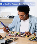 Person using All In One Desoldering Iron And Solder Sucker Tool For PCB Repair With 1.0mm And 1.2mm Nozzles, Wick And Cleaning Pin