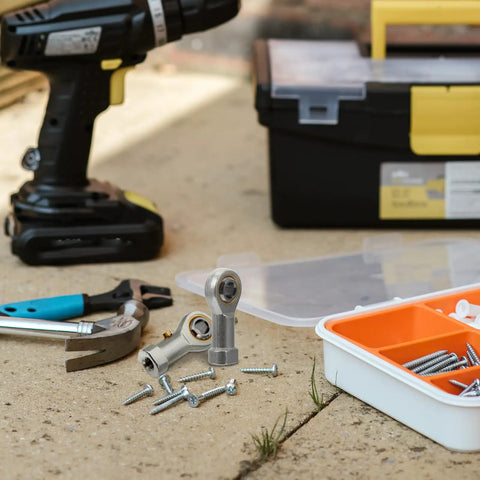 4Pc Garage Ready Threaded Rod End Bearings Equipped With Female Fish Eye Ball Joint Interface For Ironclad Industrial Power Transmission and Mechanical Linkage Systems on a workbench.