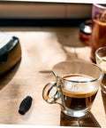 Espresso Machine Steam Wand Cover And Insulation Guard For Safe Burn Free Frothing with espresso cups on wooden table