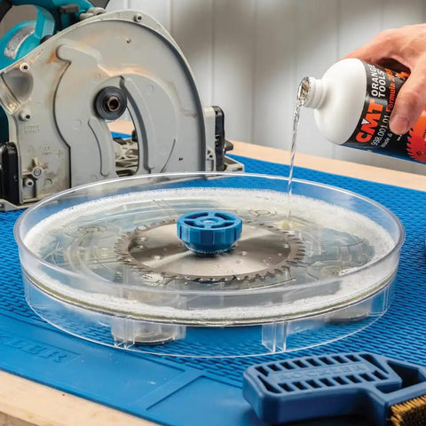 Pro Grade Saw Blade Cleaning Kit For Circular Table And Miter Saws 6 1/4 To 12 Inches with cleaner being poured into dish