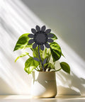 DIY Flower Welding Kit for Metal Art: 16 Gauge Stainless Steel Practice Weld Set in potted plant, 12 inch steel flower visible