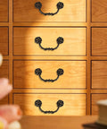 Six Pack Drop Bail Vintage Drawer Pulls For Four And A Half Inch Center To Center Spacing Zinc Alloy Handles on wooden dresser